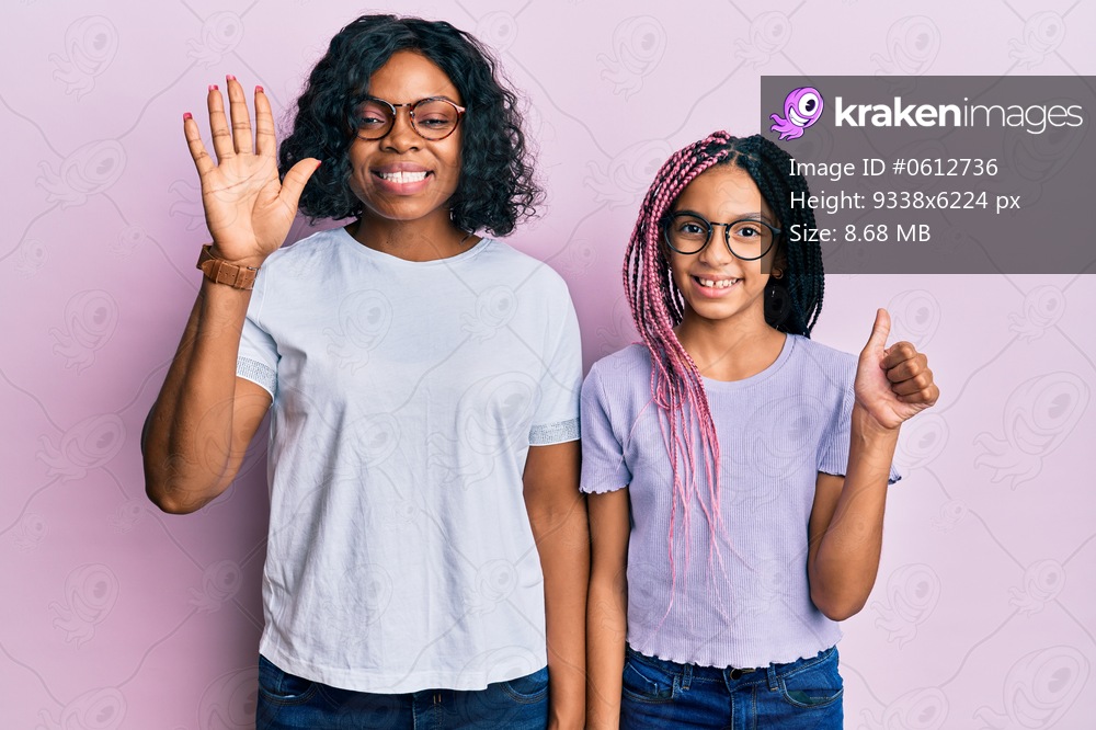 Beautiful african american mother and daughter wearing casual clothes and glasses showing and pointing up with fingers number six while smiling confident and happy. 