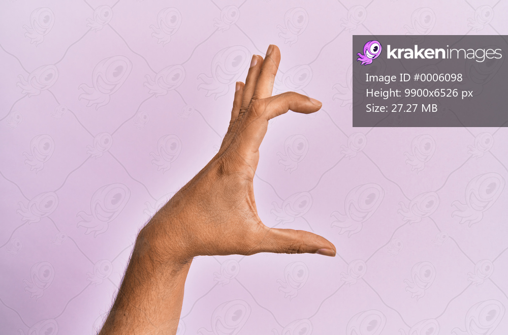 Arm and hand of caucasian young man over pink isolated background picking and taking invisible thing, holding object with fingers showing space 