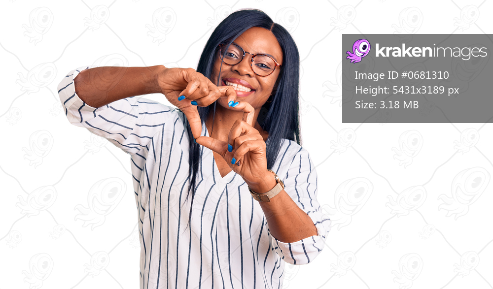 Young african american woman wearing casual clothes and glasses smiling in love doing heart symbol shape with hands. romantic concept. 