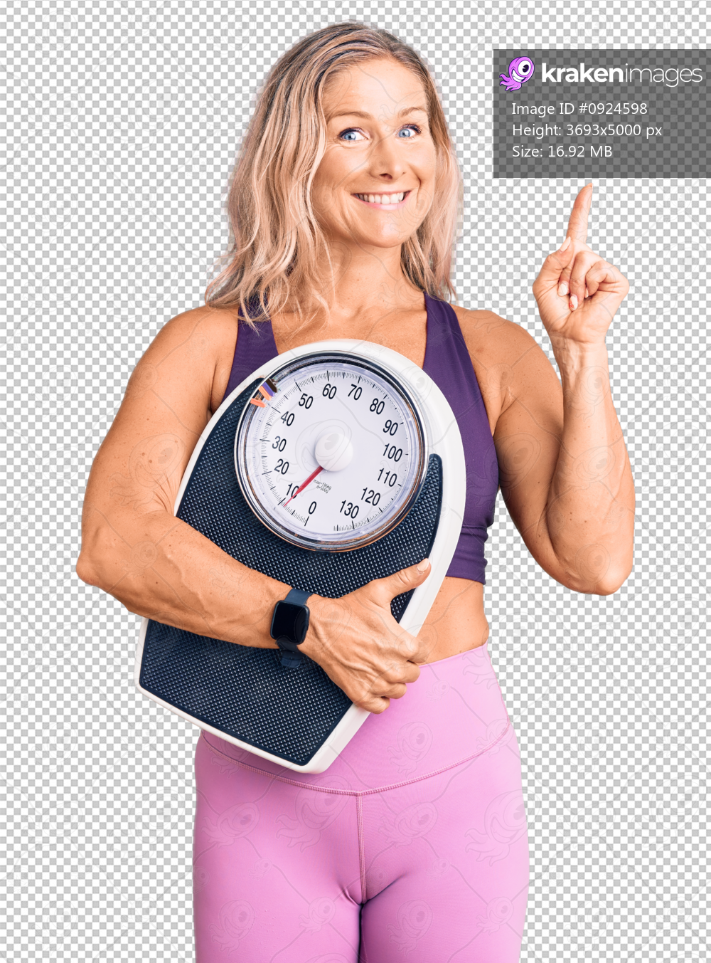 Middle age fit blonde woman wearing sports clothes holding weighing machine surprised with an idea or question pointing finger with happy face, number one