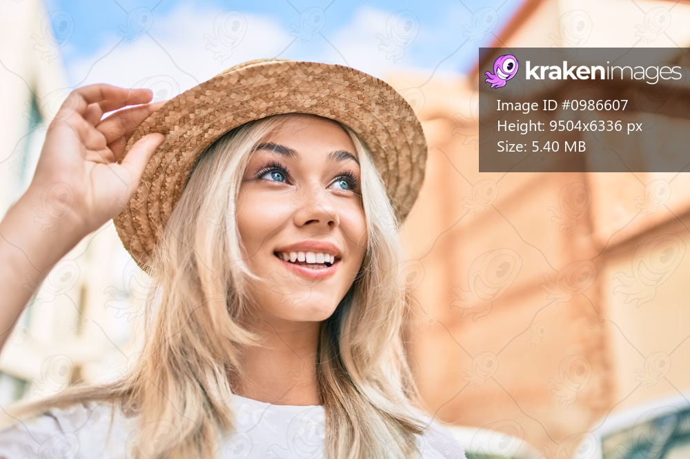 Young caucasian tourist girl smiling happy walking at street of city.