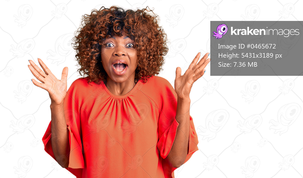 Young african american woman wearing casual clothes celebrating crazy and amazed for success with arms raised and open eyes screaming excited. winner concept 