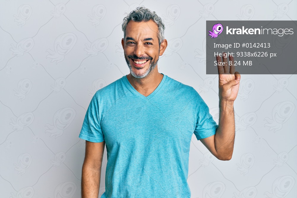 Middle age grey-haired man wearing casual clothes showing and pointing up with fingers number three while smiling confident and happy. 