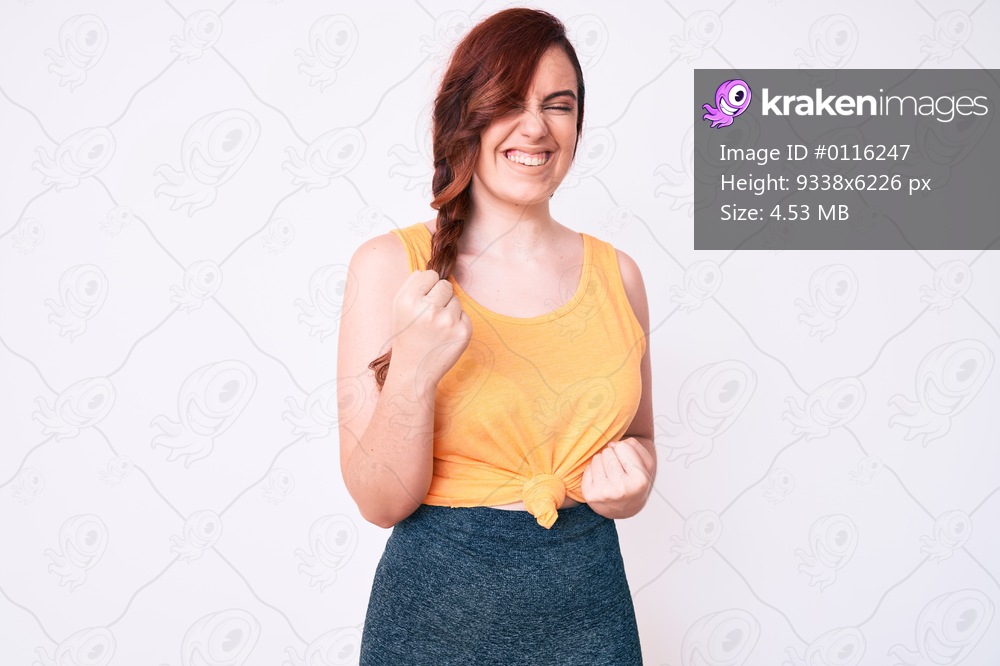 Young beautiful woman wearing casual clothes celebrating surprised and amazed for success with arms raised and eyes closed 