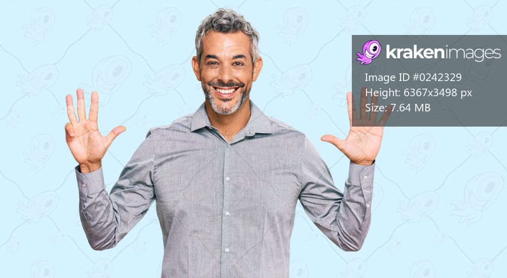 Middle age grey-haired man wearing casual clothes showing and pointing up with fingers number nine while smiling confident and happy. 