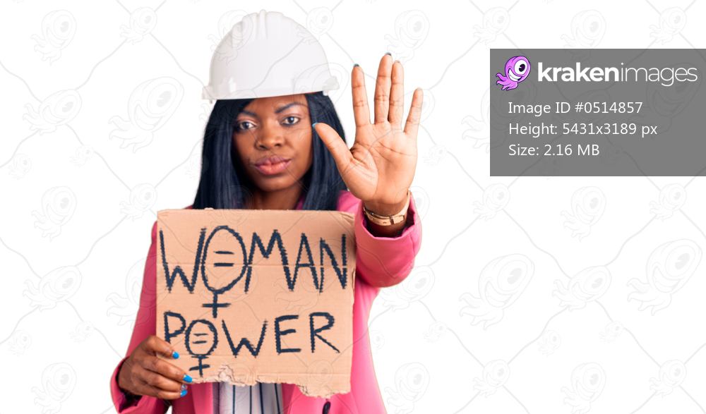 Young african american woman wearing architect helmet holding woman power banner with open hand doing stop sign with serious and confident expression, defense gesture 