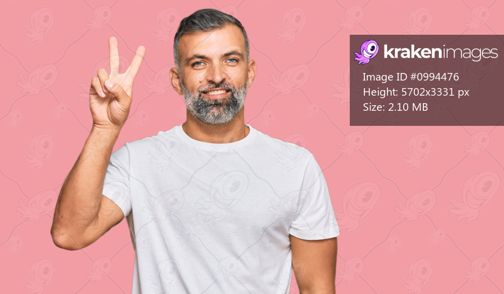 Middle age handsome man wearing casual white tshirt smiling looking to the camera showing fingers doing victory sign. number two. 