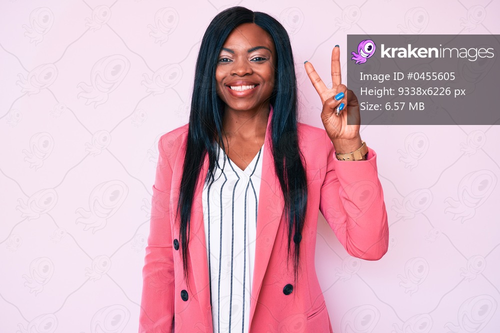 Young african american woman wearing business clothes showing and pointing up with fingers number two while smiling confident and happy. 
