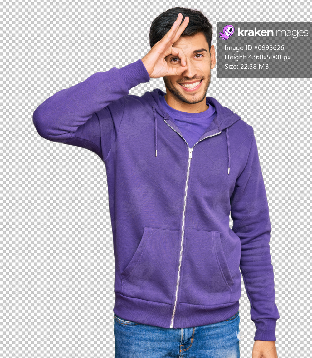 Young handsome man wearing casual sweatshirt smiling happy doing ok sign with hand on eye looking through fingers