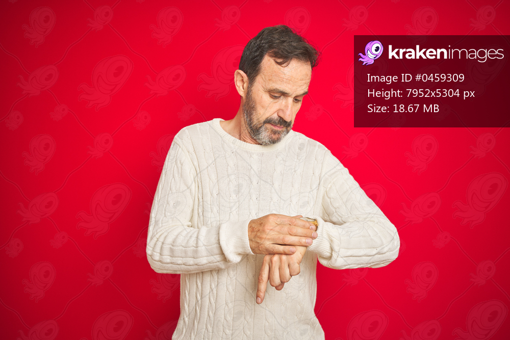 Handsome middle age senior man with grey hair over isolated red background Checking the time on wrist watch, relaxed and confident