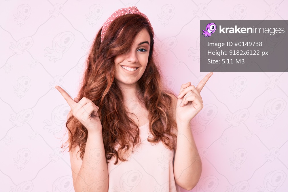 Young beautiful woman wearing casual clothes smiling confident pointing with fingers to different directions. copy space for advertisement 