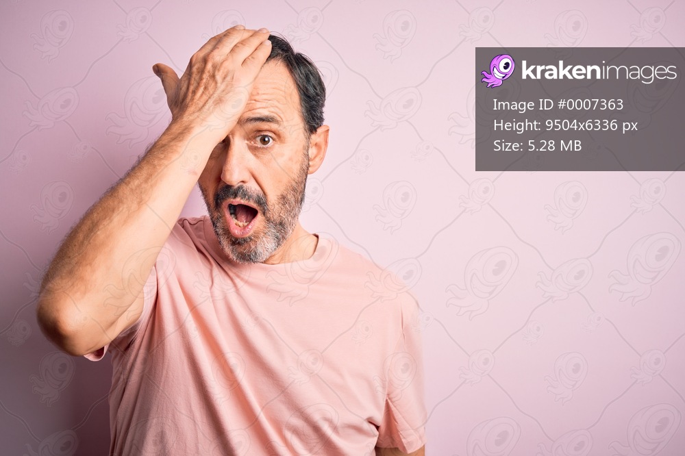 Middle age hoary man wearing casual t-shirt standing over isolated pink background surprised with hand on head for mistake, remember error. Forgot, bad memory concept.