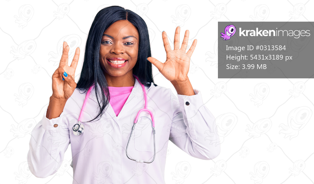 Young african american woman wearing doctor stethoscope showing and pointing up with fingers number eight while smiling confident and happy. 