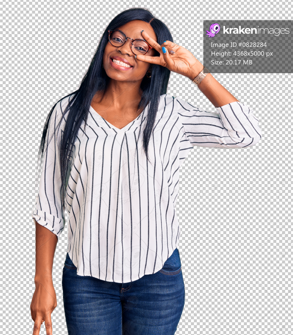 Young african american woman wearing casual clothes and glasses doing peace symbol with fingers over face, smiling cheerful showing victory
