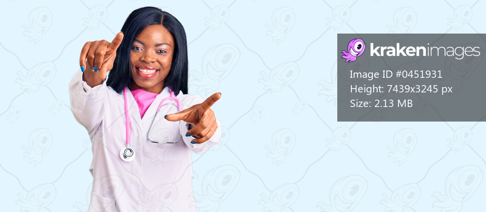 Young african american woman wearing doctor stethoscope pointing to you and the camera with fingers, smiling positive and cheerful 