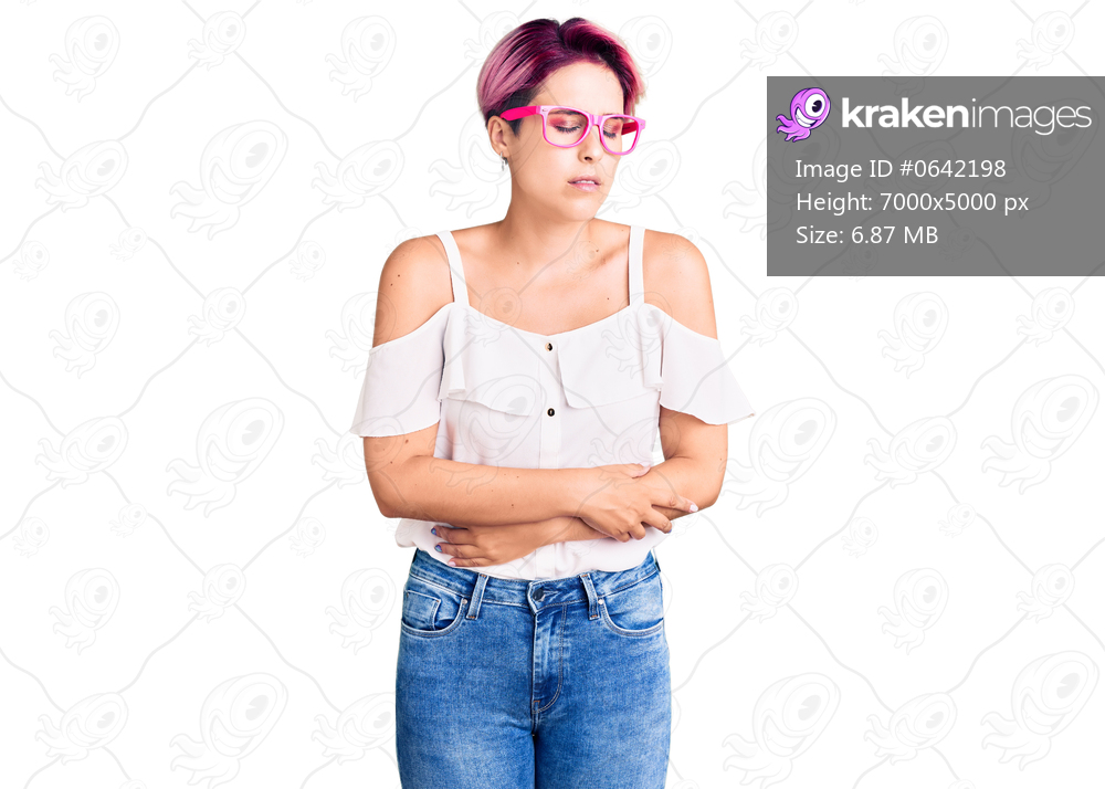 Young beautiful woman with pink hair wearing casual clothes and glasses with hand on stomach because indigestion, painful illness feeling unwell. ache concept. 
