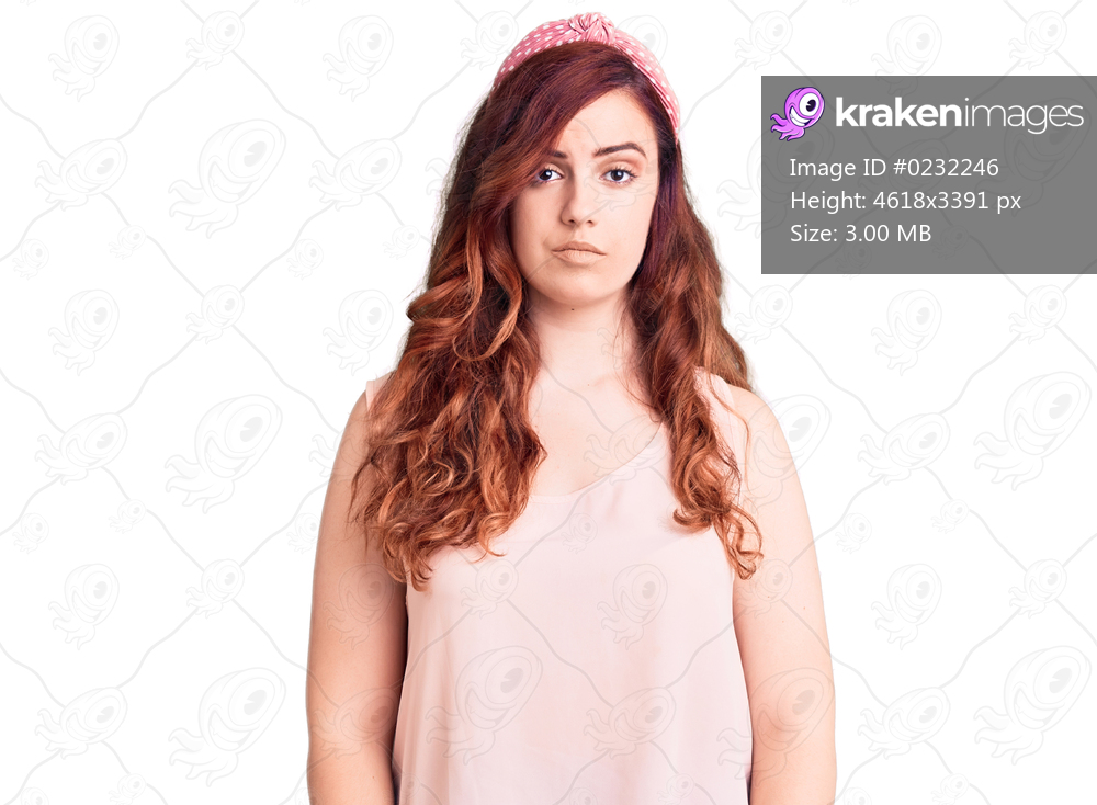 Young beautiful woman wearing casual clothes and diadem with serious expression on face. simple and natural looking at the camera. 