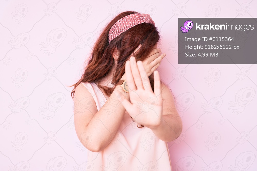 Young beautiful woman wearing casual clothes covering eyes with hands and doing stop gesture with sad and fear expression. embarrassed and negative concept. 