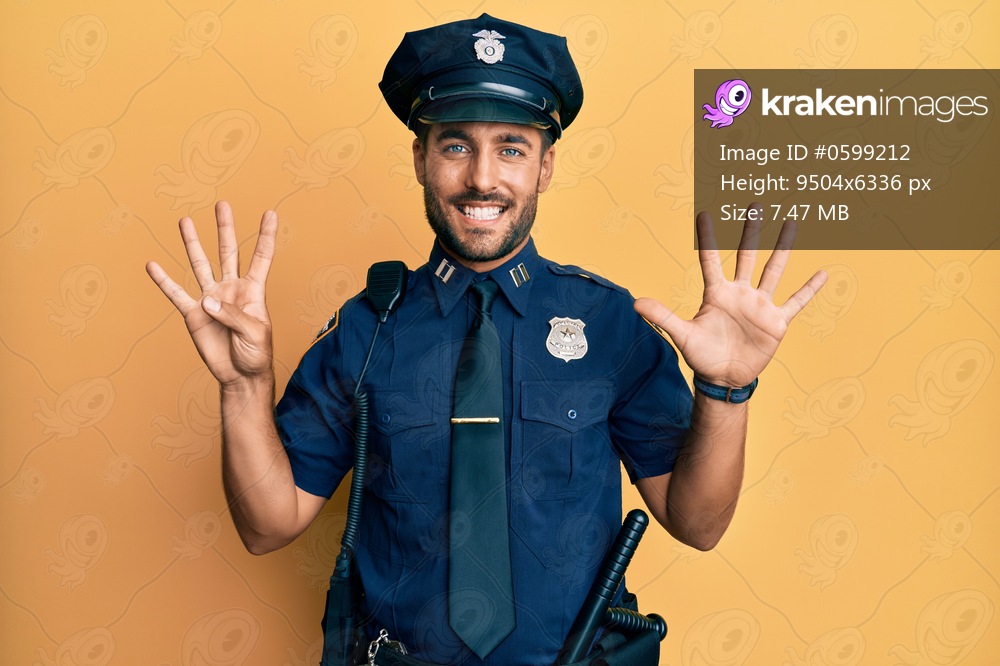 Handsome hispanic man wearing police uniform showing and pointing up with fingers number nine while smiling confident and happy. 