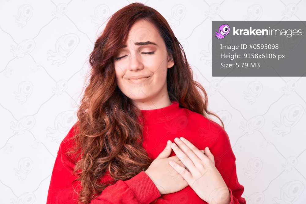 Young beautiful woman wearing casual clothes smiling with hands on chest with closed eyes and grateful gesture on face. health concept. 