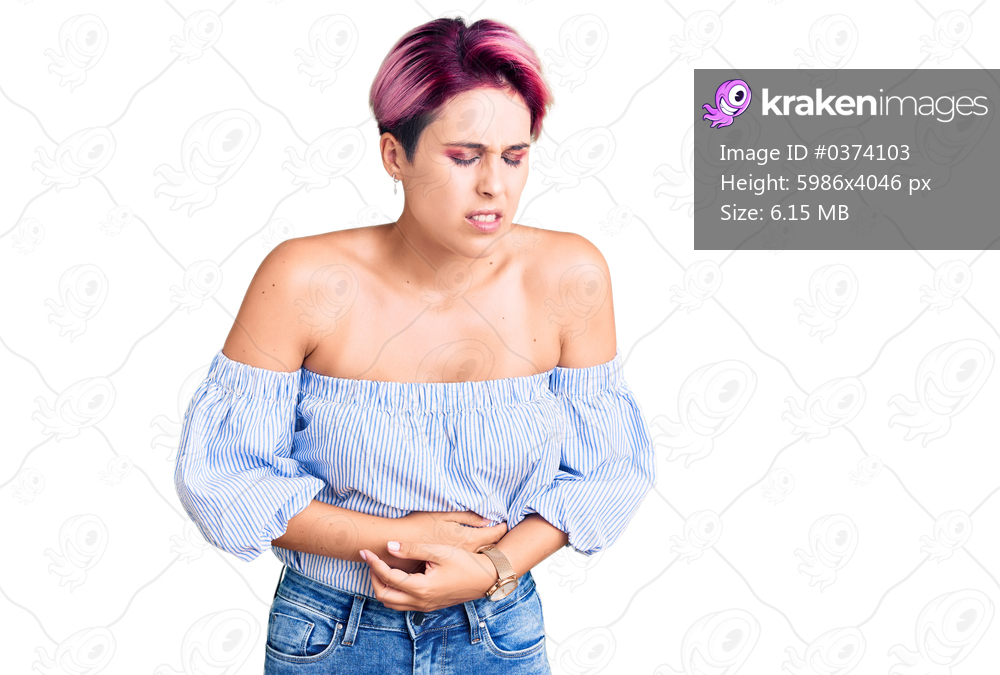 Young beautiful woman with pink hair wearing casual clothes with hand on stomach because indigestion, painful illness feeling unwell. ache concept. 