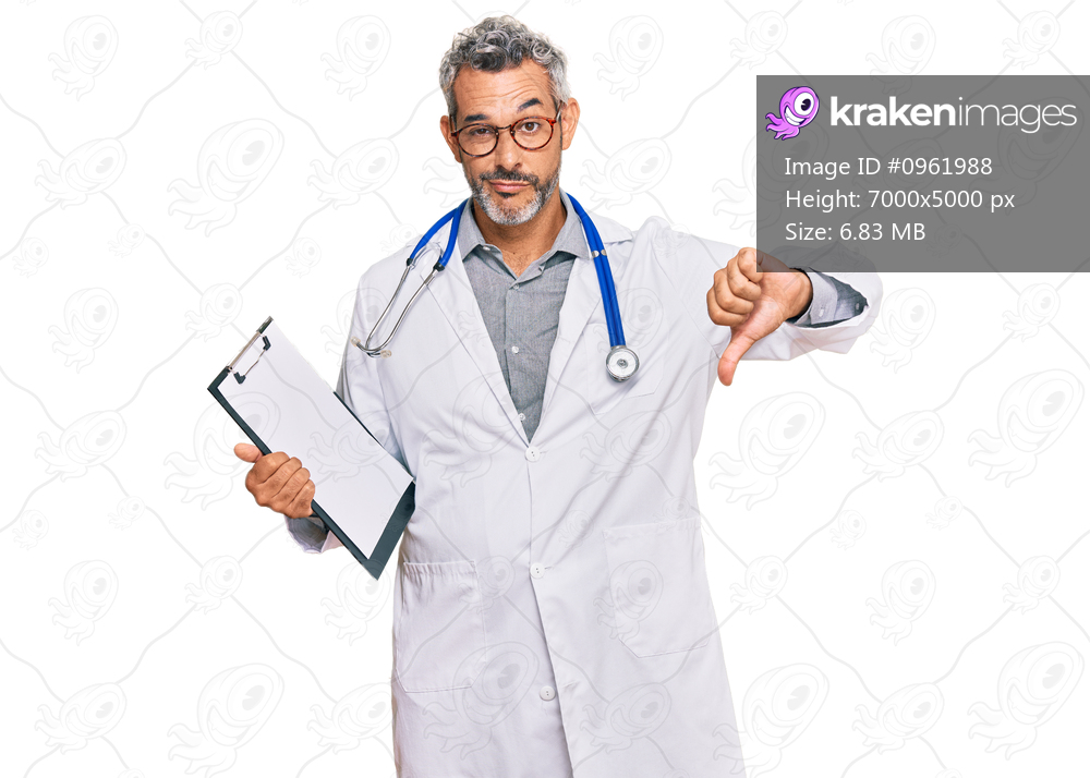 Middle age grey-haired man wearing doctor stethoscope holding clipboard with angry face, negative sign showing dislike with thumbs down, rejection concept 
