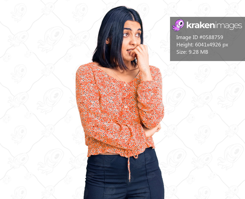 Young beautiful latin woman wearing casual clothes looking stressed and nervous with hands on mouth biting nails. anxiety problem. 