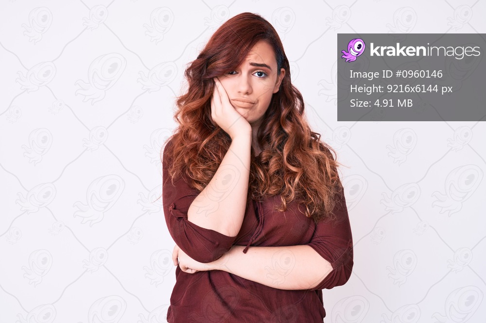 Young beautiful woman wearing casual clothes thinking looking tired and bored with depression problems with crossed arms. 