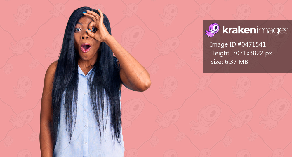 Young african american woman wearing casual clothes doing ok gesture shocked with surprised face, eye looking through fingers. unbelieving expression. 