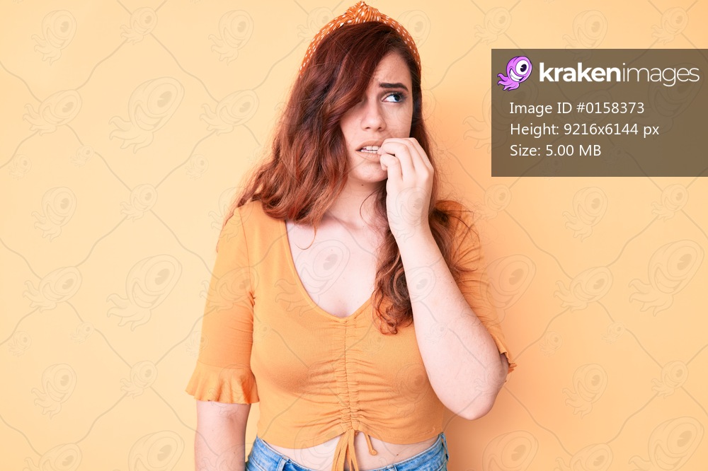 Young beautiful woman wearing casual clothes looking stressed and nervous with hands on mouth biting nails. anxiety problem. 