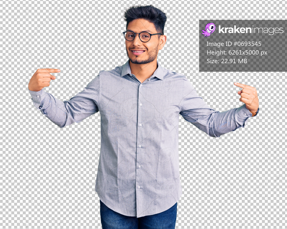 Handsome latin american young man wearing business clothes and glasses looking confident with smile on face, pointing oneself with fingers proud and happy.