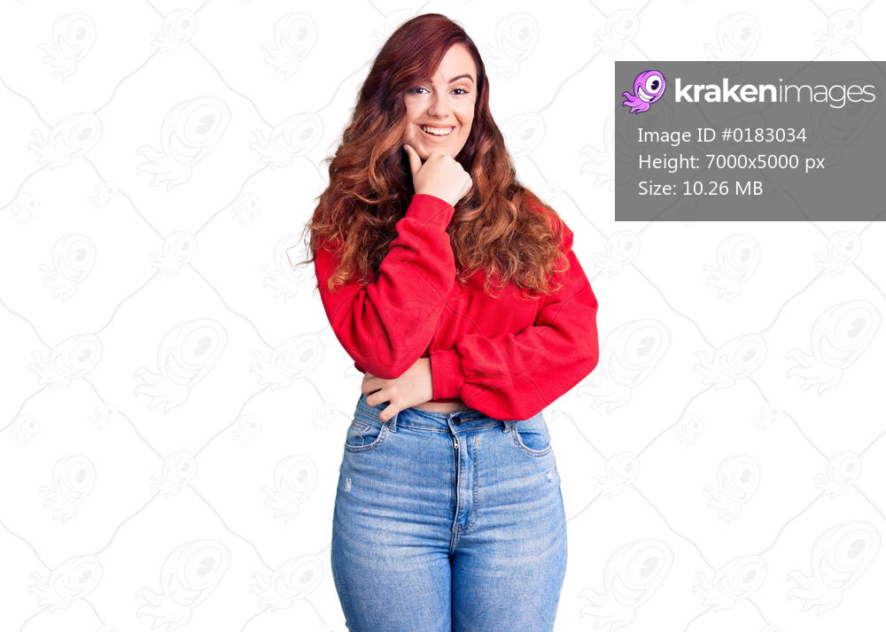 Young beautiful woman wearing casual winter sweater looking confident at the camera smiling with crossed arms and hand raised on chin. thinking positive. 