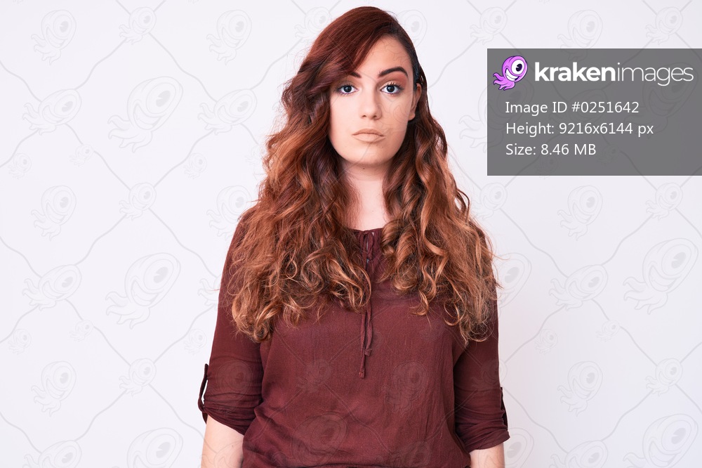 Young beautiful woman wearing casual clothes with serious expression on face. simple and natural looking at the camera. 