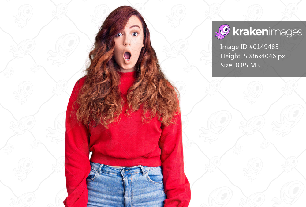 Young beautiful woman wearing casual winter sweater afraid and shocked with surprise expression, fear and excited face. 