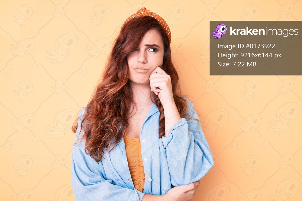 Young beautiful woman wearing casual clothes thinking concentrated about doubt with finger on chin and looking up wondering 