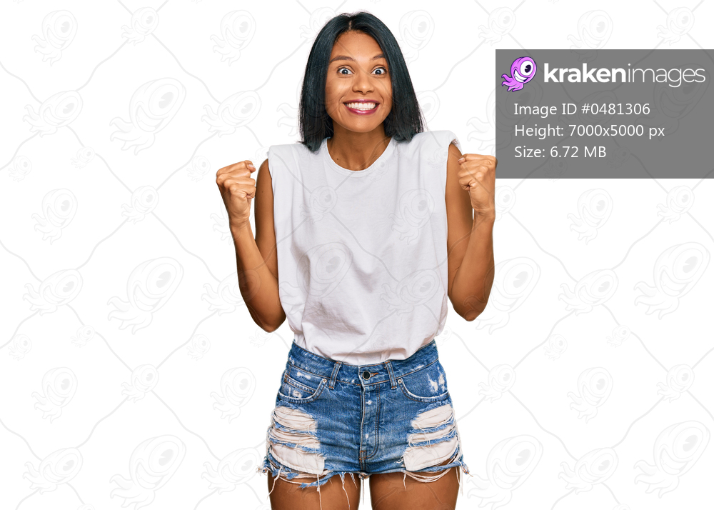 Young african american woman wearing casual clothes celebrating surprised and amazed for success with arms raised and open eyes. winner concept. 
