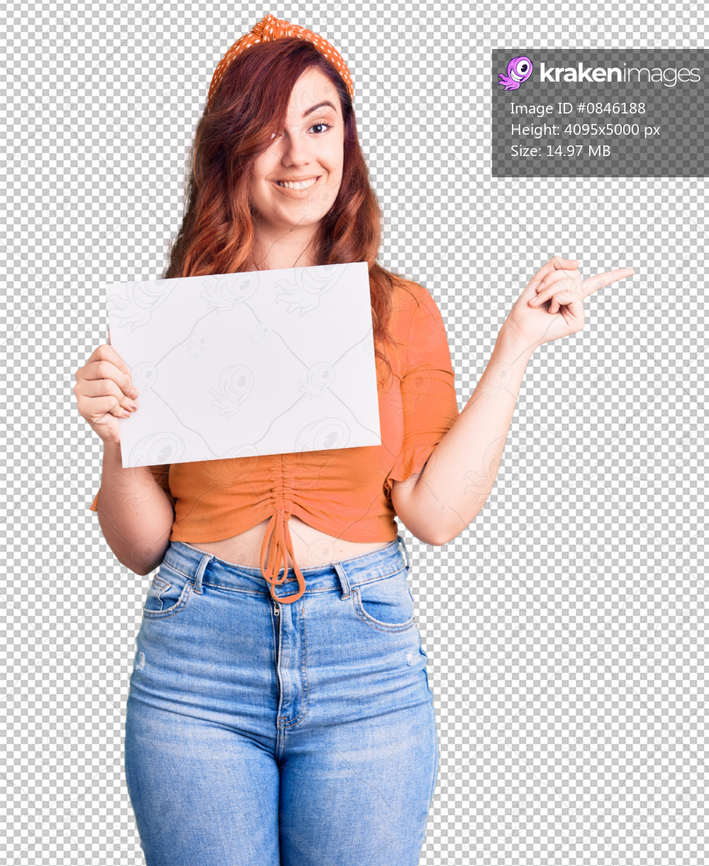 Young beautiful woman holding cardboard banner with blank space smiling happy pointing with hand and finger to the side