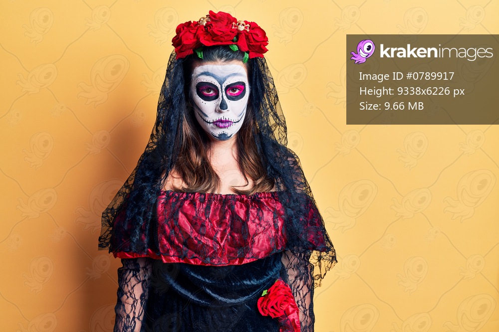 Young woman wearing day of the dead costume over yellow skeptic and nervous, frowning upset because of problem. negative person. 