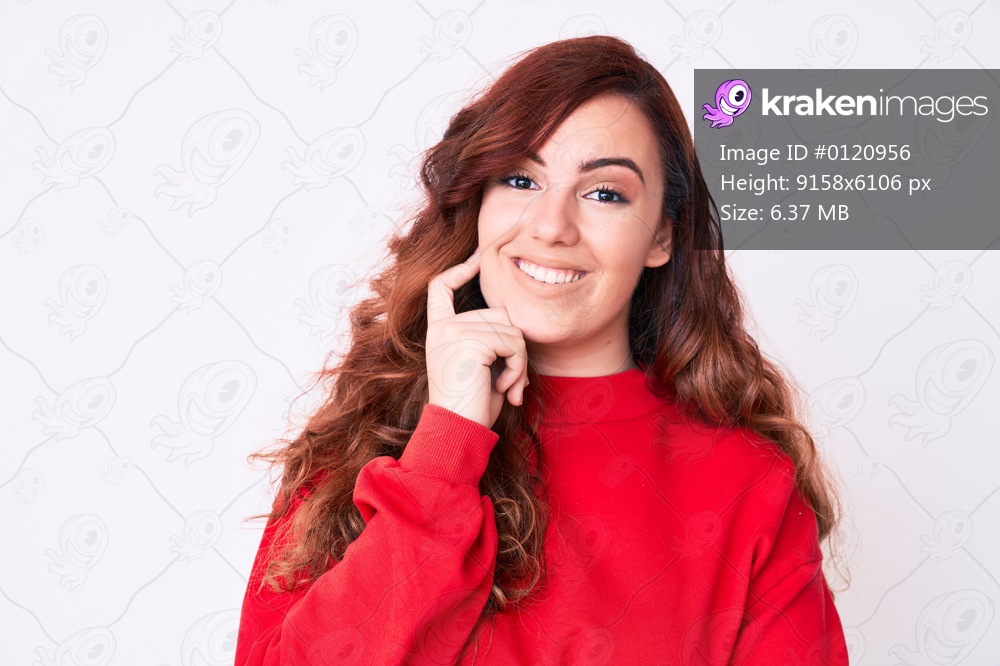 Young beautiful woman wearing casual clothes looking confident at the camera with smile with crossed arms and hand raised on chin. thinking positive. 