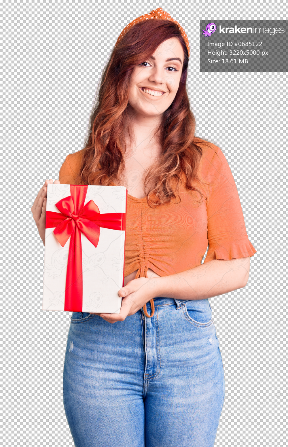 Young beautiful woman holding gift looking positive and happy standing and smiling with a confident smile showing teeth