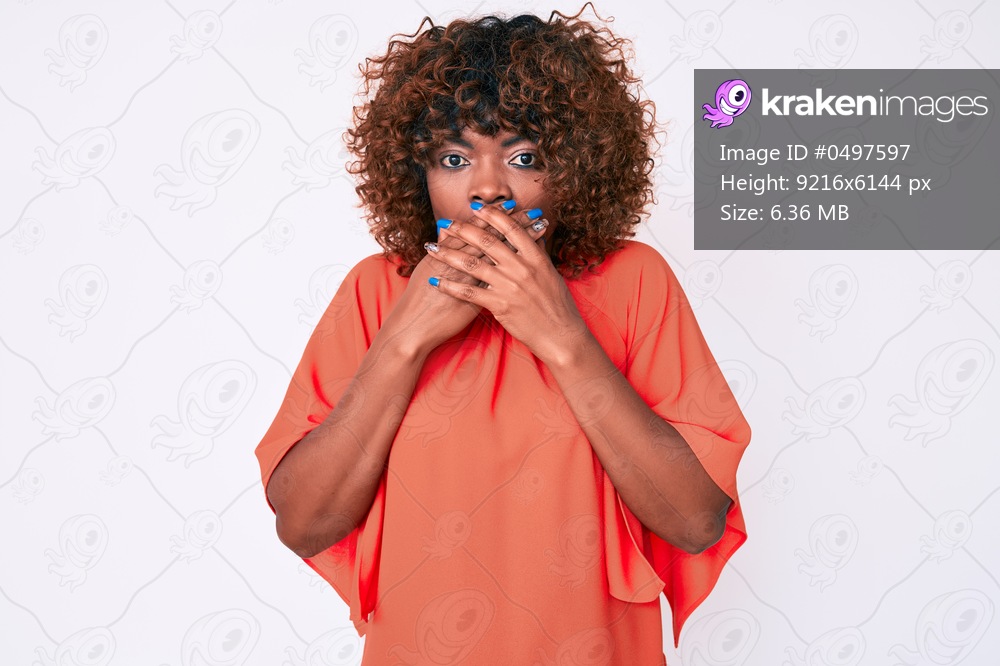 Young african american woman wearing casual clothes shocked covering mouth with hands for mistake. secret concept. 