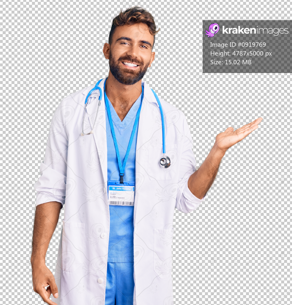 Young hispanic man wearing doctor uniform and stethoscope smiling cheerful presenting and pointing with palm of hand looking at the camera.