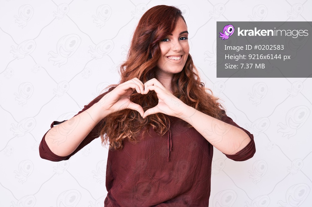 Young beautiful woman wearing casual clothes smiling in love showing heart symbol and shape with hands. romantic concept. 
