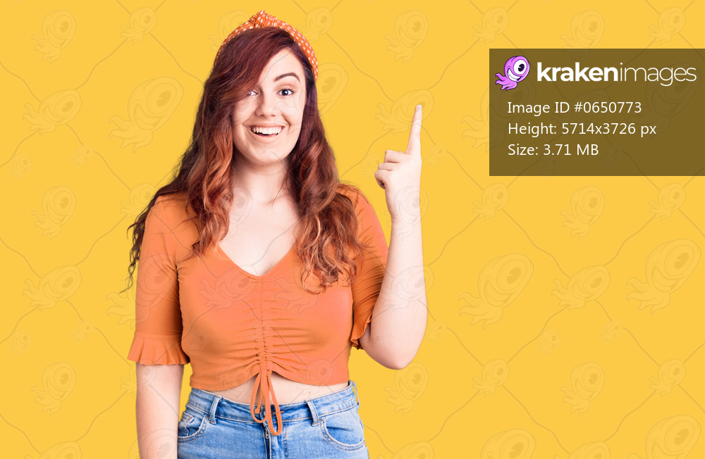 Young beautiful woman wearing casual clothes pointing finger up with successful idea. exited and happy. number one. 