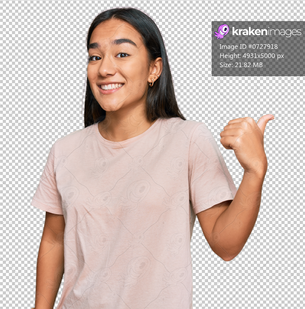 Young asian woman wearing casual clothes smiling with happy face looking and pointing to the side with thumb up.