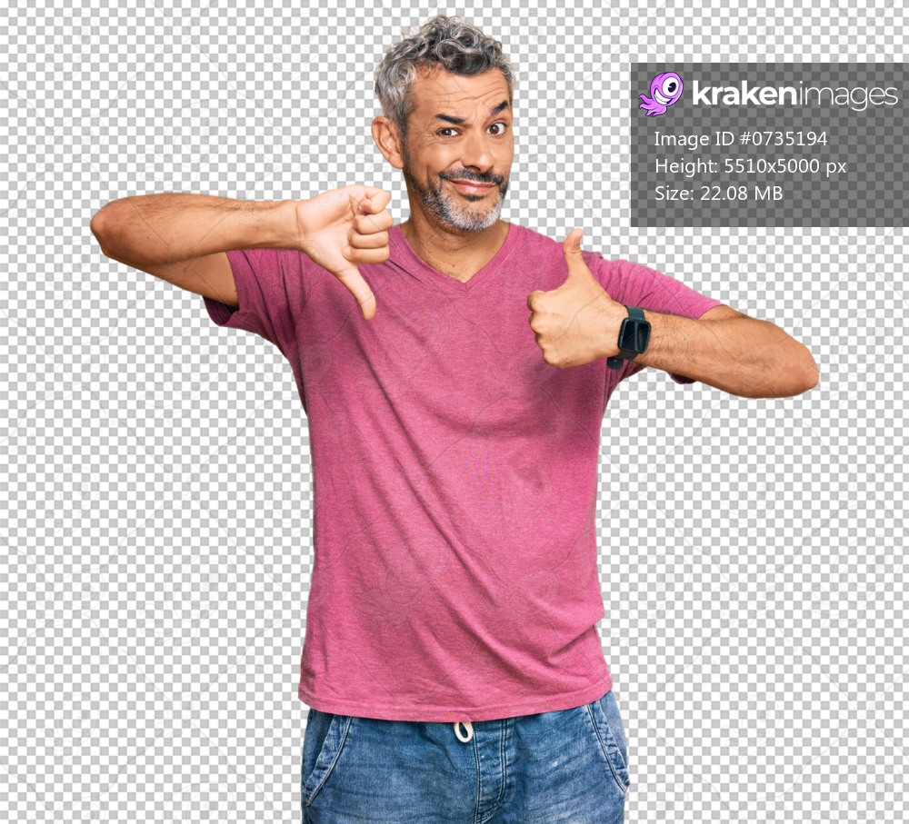 Middle age grey-haired man wearing casual clothes doing thumbs up and down, disagreement and agreement expression. crazy conflict