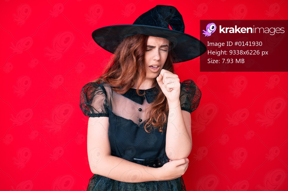 Young beautiful woman wearing witch halloween costume feeling unwell and coughing as symptom for cold or bronchitis. health care concept. 