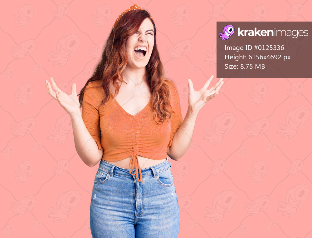 Young beautiful woman wearing casual clothes crazy and mad shouting and yelling with aggressive expression and arms raised. frustration concept. 