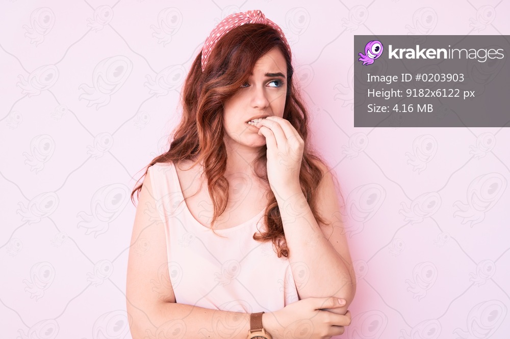 Young beautiful woman wearing casual clothes looking stressed and nervous with hands on mouth biting nails. anxiety problem. 