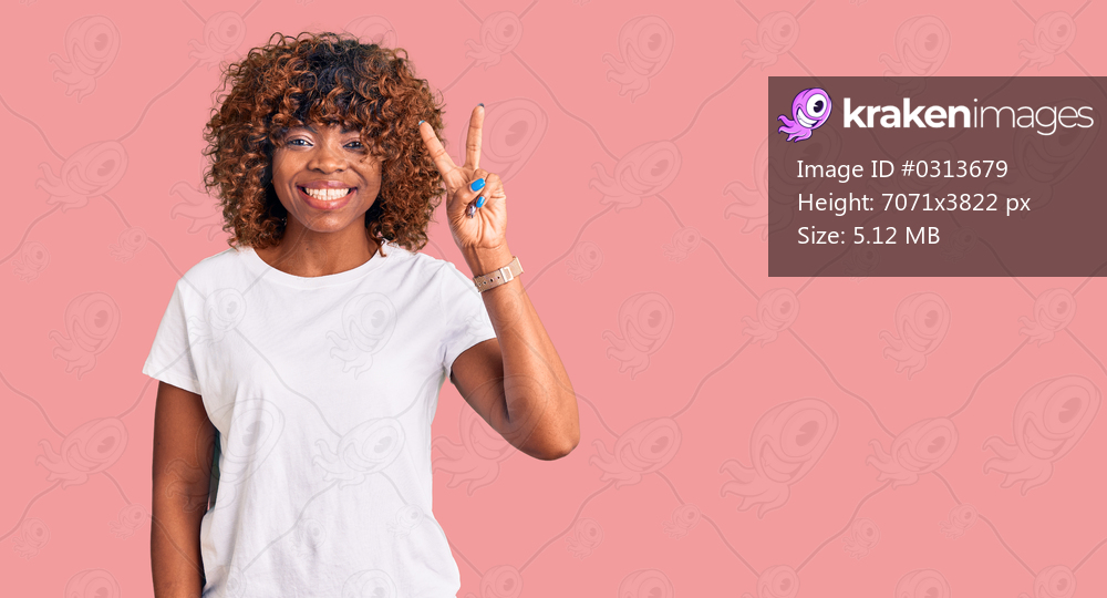 Young african american woman wearing casual white tshirt showing and pointing up with fingers number two while smiling confident and happy. 